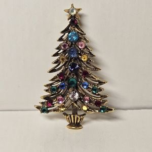 Vintage Christmas tree brooch with rhinestones.